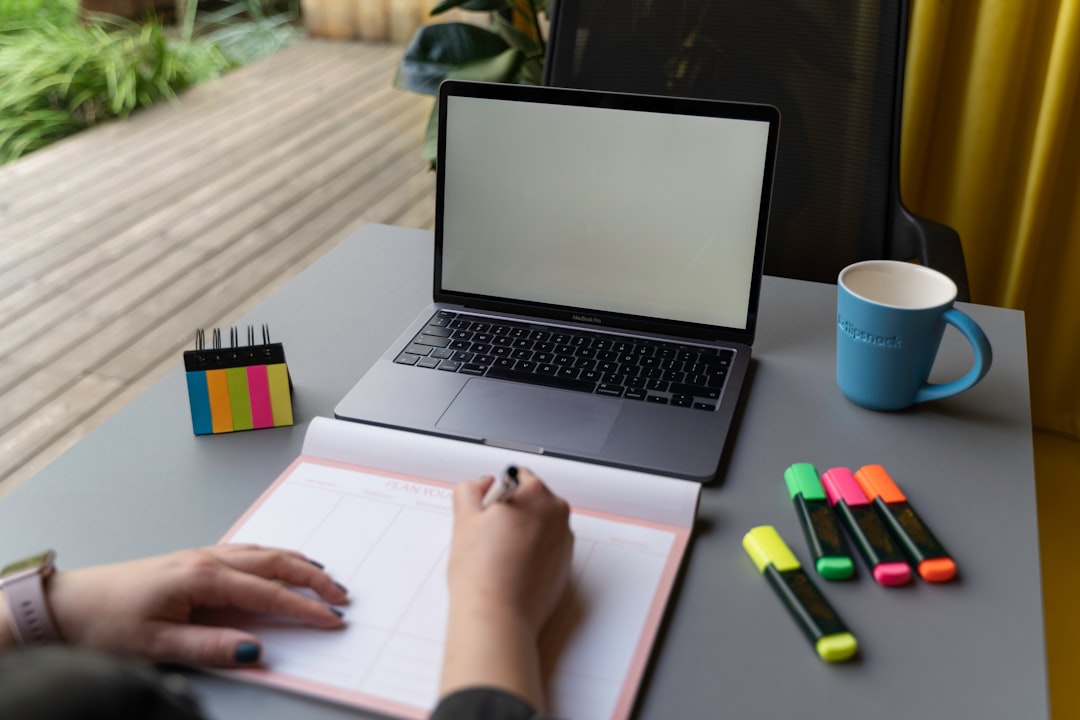 person writing laptop