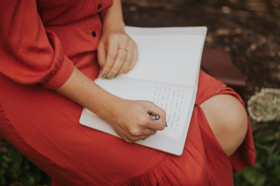 person writing journal